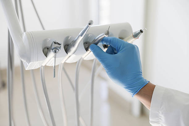 Professional Tooth Extraction technician working in Knoxville, IL